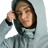 Burton Women's Lelah 2L Jacket 2025 - A light blue jacket with a hood, featuring a zipper and two zippered pockets on the front.