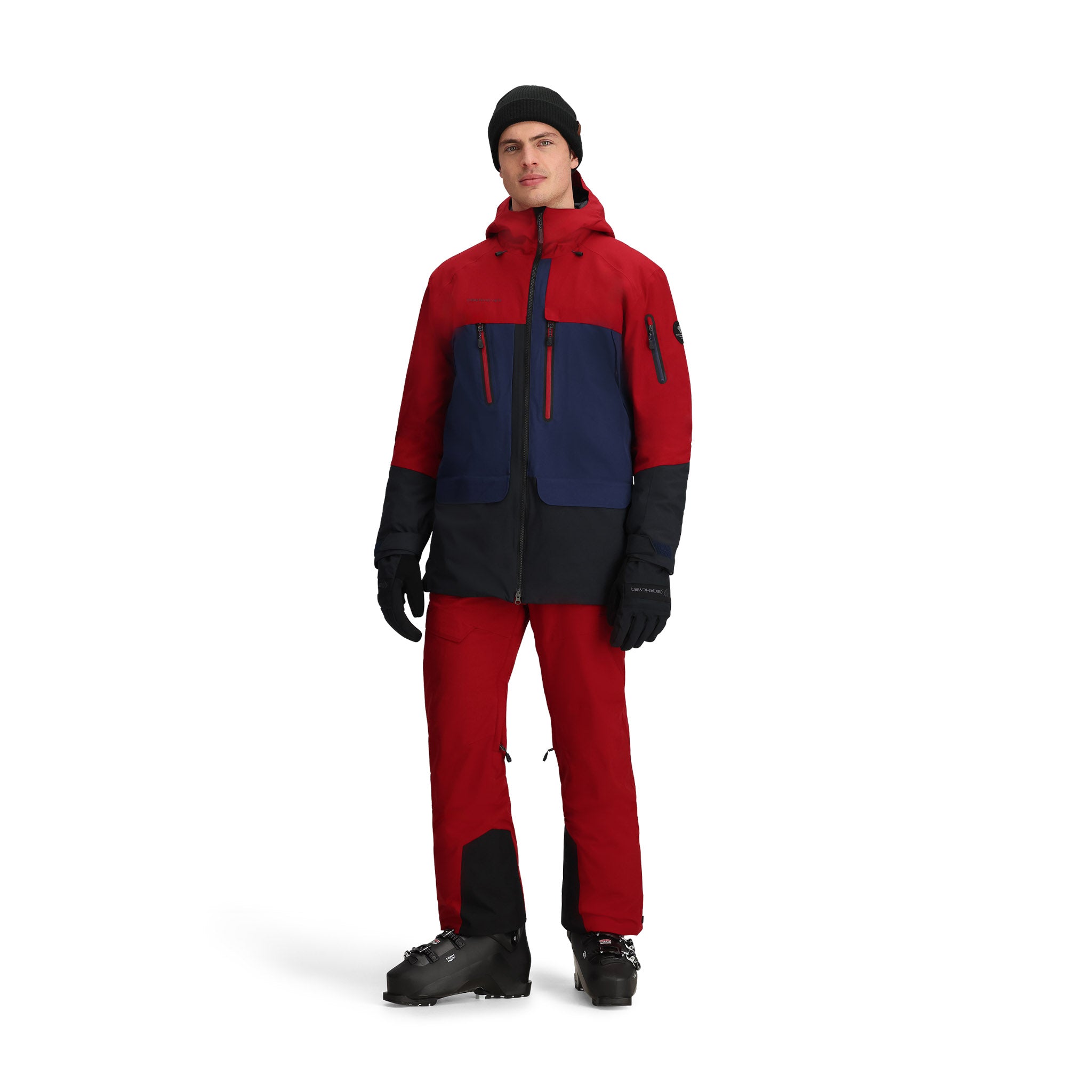 Obermeyer Cirque Jacket - A red, navy blue, and black jacket with a hood, zippered pockets, and a front zipper.