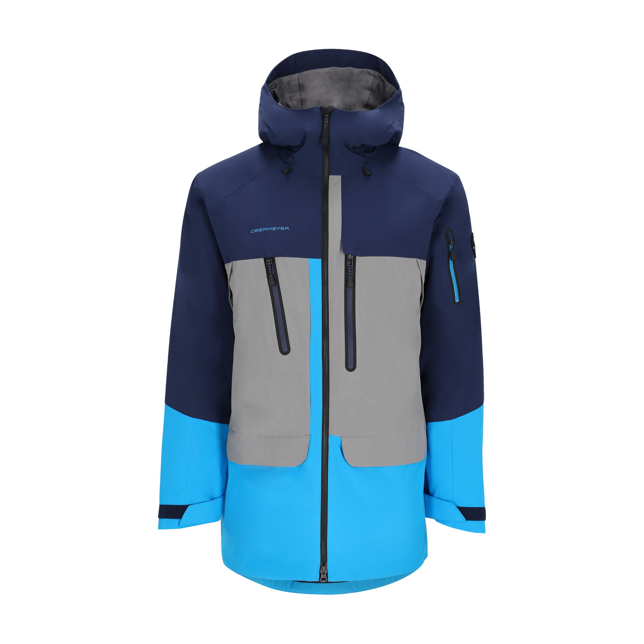 Obermeyer Cirque Jacket 2025 - A navy blue, gray, and light blue ski jacket with a hood, featuring two zippered pockets on the front.