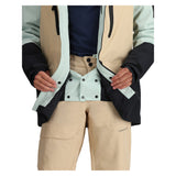 Obermeyer Cirque Jacket 2025 - A tan-colored jacket with a black zipper and two black buttons on the front, featuring a hood and adjustable cuffs.
