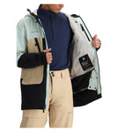 Obermeyer Cirque Jacket - A light blue jacket with a black zipper and two zippered pockets on the front.