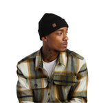 Coal Harbor Rib Knit Beanie 2025 - Black beanie with a small brown logo on the front.