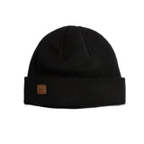 Coal Harbor Rib Knit Beanie 2025 - A black beanie with a brown leather patch on the front featuring the word "COAL" in block letters.