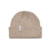 Coal Frena Low Profile Beanie 2025 - A tan beanie with a white label featuring the word "COAL" in black letters.