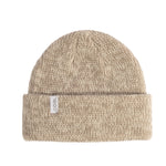 Beige knit beanie with a Coal brand label on a light background