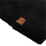 Coal Women's Pearl Fuzzy Knit Beanie - A black beanie with a fuzzy knit texture and a small, rectangular brown leather patch on the front that says "COAL" in white letters.
