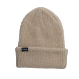 Coal Women's Pearl Fuzzy Knit Beanie 2025 - A light-colored beanie with a fuzzy knit texture and a subtle sheen, featuring a small black label with white lettering that reads "COAL" on the front.