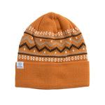 Coal Fjord Nordic Beanie 2025 - A light orange beanie with a pattern of white, gray, and dark brown zigzags and dots.