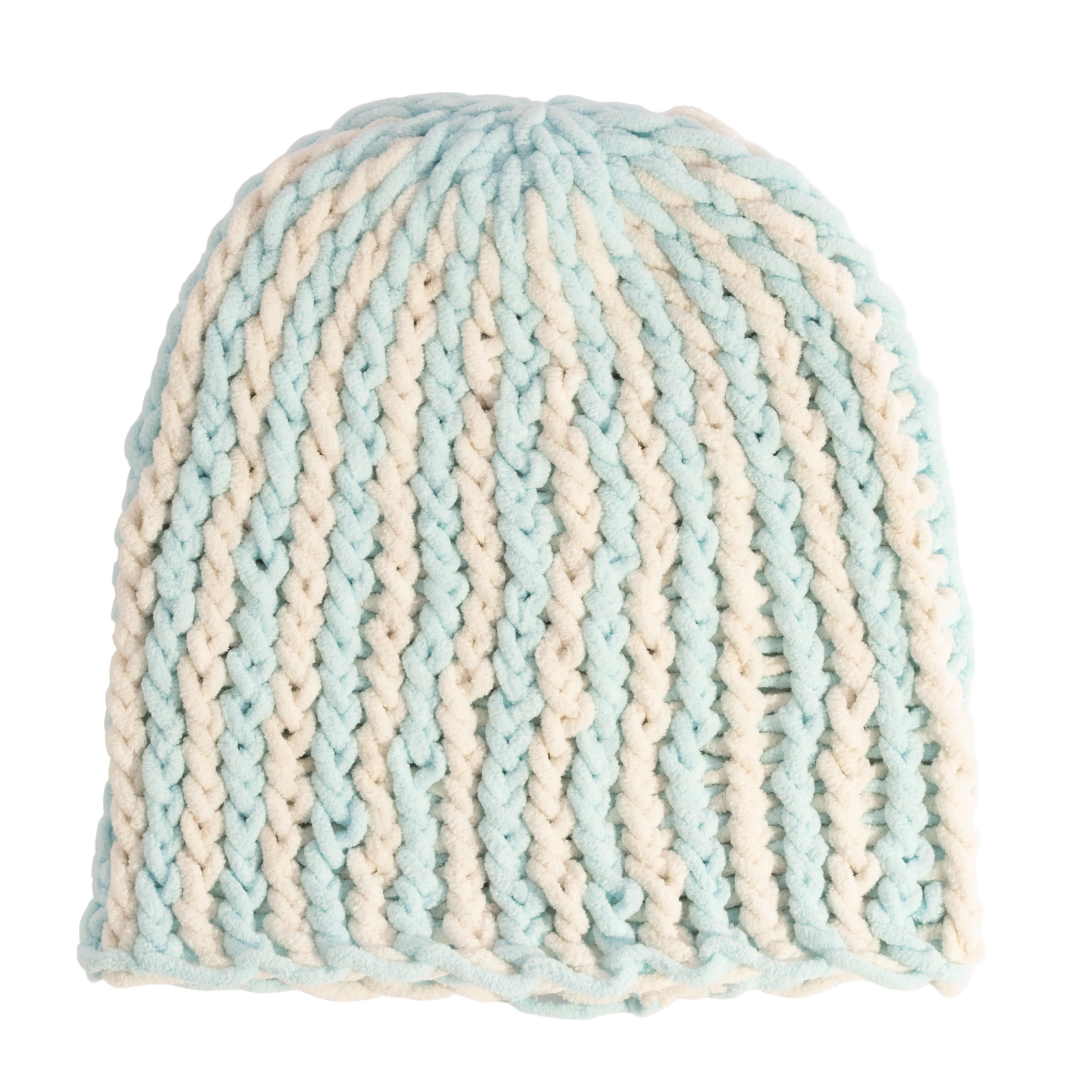 Knitted beanie with blue and beige stripes on a light gray background