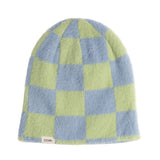 Checkered beanie with green and blue squares on a white background