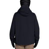 Black shell jacket back view with full hood and zipper; hem over tan pants.
