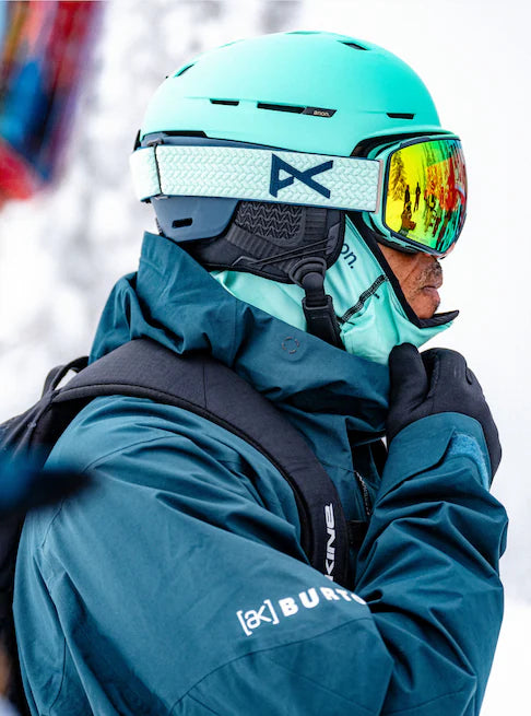 Anon Merak Wavecel Helmet 2023 - A black helmet with a white logo on the side and a strap under the chin.