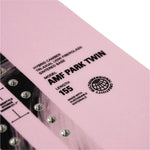 Whitespace AMF Park Twin Limited Edition Snowboard 2024 - A limited edition snowboard with a sleek design and unique color scheme, featuring a distinctive logo on its top surface.