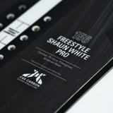 Whitespace Freestyle Shaun White Pro Limited Edition Snowboard 2024 - A black snowboard with white lettering and a distinctive "Whitespace" logo on top.