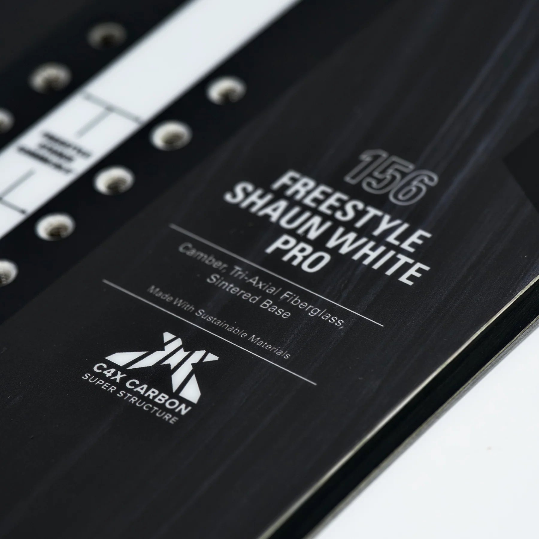 Whitespace Freestyle Shaun White Pro Limited Edition Snowboard 2024 - A black snowboard with white lettering and a distinctive "Whitespace" logo on top.