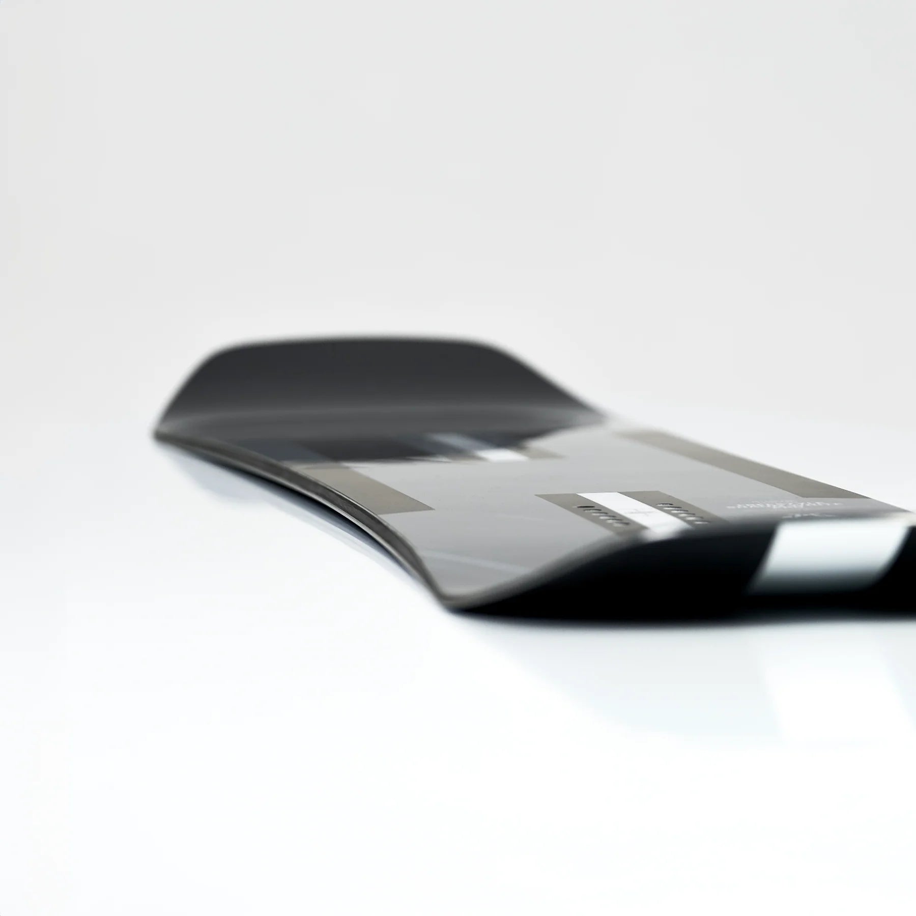 Whitespace Freestyle Shaun White Pro Limited Edition Snowboard 2024 - A black snowboard with a white stripe down the middle and a distinctive "Pro" logo on top.