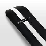 Whitespace Freestyle Shaun White Pro Limited Edition Snowboard 2024 - A black snowboard with a white stripe down the middle and a distinctive "S" logo on top, featuring a sleek design with a subtle sheen.