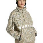 Burton Women's Frosnter Anorak Jacket 2025 - A tan jacket with a white and green snowflake pattern, featuring a hood and zippered pockets.