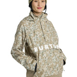Burton Women's Frosnter Anorak Jacket 2025 - A tan jacket with a white and green snowflake pattern, featuring a hood and zippered pockets.