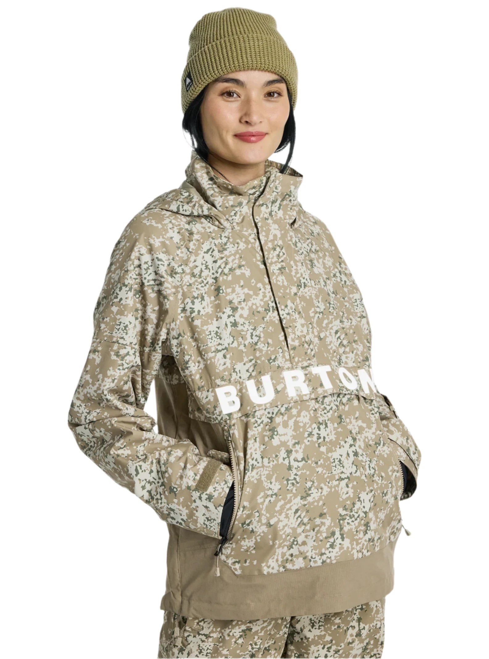 Burton Women's Frosnter Anorak Jacket 2025 - A tan jacket with a white and green snowflake pattern, featuring a hood and zippered pockets.