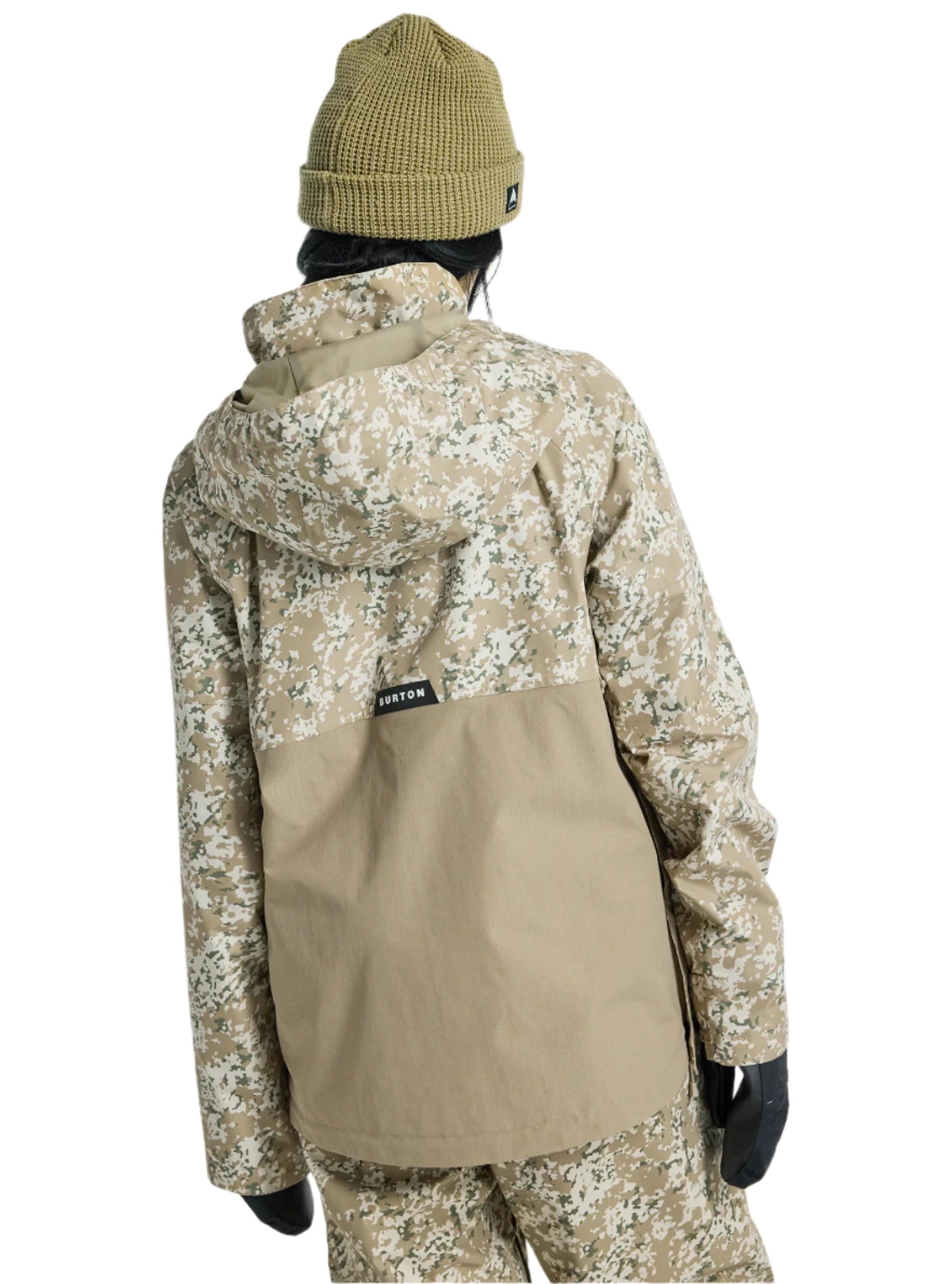 Burton Women's Frosnter Anorak Jacket 2025 - A tan jacket with a white and green snowflake pattern, featuring a hood and zippered pockets.
