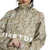 Burton Women's Frosnter Anorak Jacket 2025 - A tan jacket with a white and green snowflake pattern, worn by a woman in a beige knit hat.