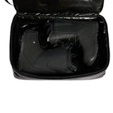 Burton Gig 70L Duffel Bag - A black duffel bag with a zippered top and two handles, featuring white stitching on the side.