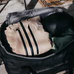 Burton Gig 70L Duffel Bag - A large, tan duffel bag with black zippers and accents.