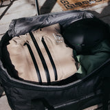 Burton Gig 70L Duffel Bag - A large, tan duffel bag with black zippers and accents.