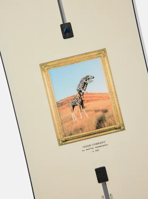 Burton Good Company Snowboard 2025 - A snowboard with a white background and blue text that reads "Good Company" in a stylized font, featuring a mountain range silhouette at the top.