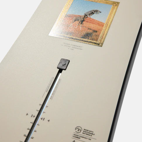 Burton Good Company Snowboard 2025 - A white snowboard with a black and red logo on top of it.