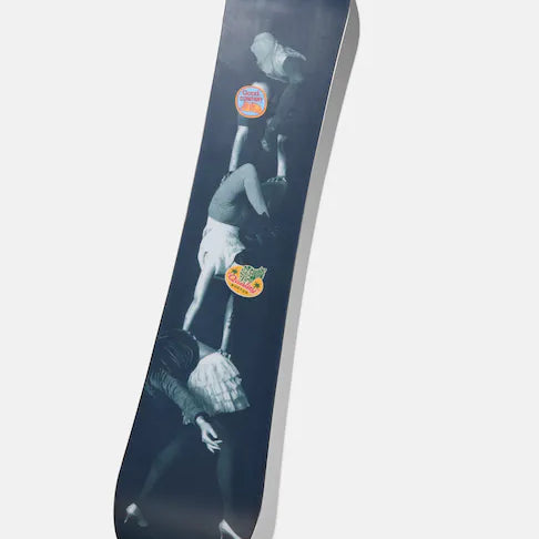 Burton Good Company Snowboard 2025 - A black snowboard with a white logo and text on top, featuring a man riding it in mid-air.