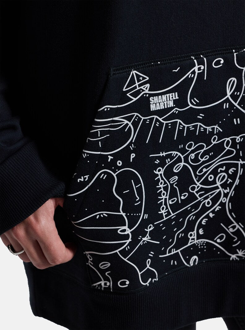 Anon Shantell Martin Pullover Hoodie - A black hoodie with a white line drawing of mountains and faces, featuring the words "Shantell Martin" in white at the top.