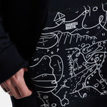 Anon Shantell Martin Pullover Hoodie - A black hoodie with a white line drawing of mountains and faces, featuring the words "Shantell Martin" in white at the top.