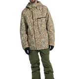 Burton Covert 2.0 2L Insulated Jacket 2025 - A tan jacket with a black and white snowflake pattern, featuring a hood and zippered pockets.