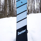 Burton Junior's Smalls Snowboard 2025 - A light blue snowboard with black stripes and a small logo at the top.