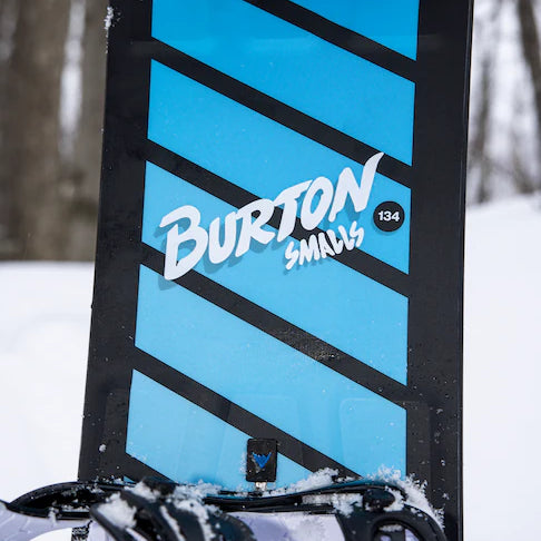 Burton Junior's Smalls Snowboard 2025 - A blue snowboard with black stripes and a small logo on the bottom left corner.