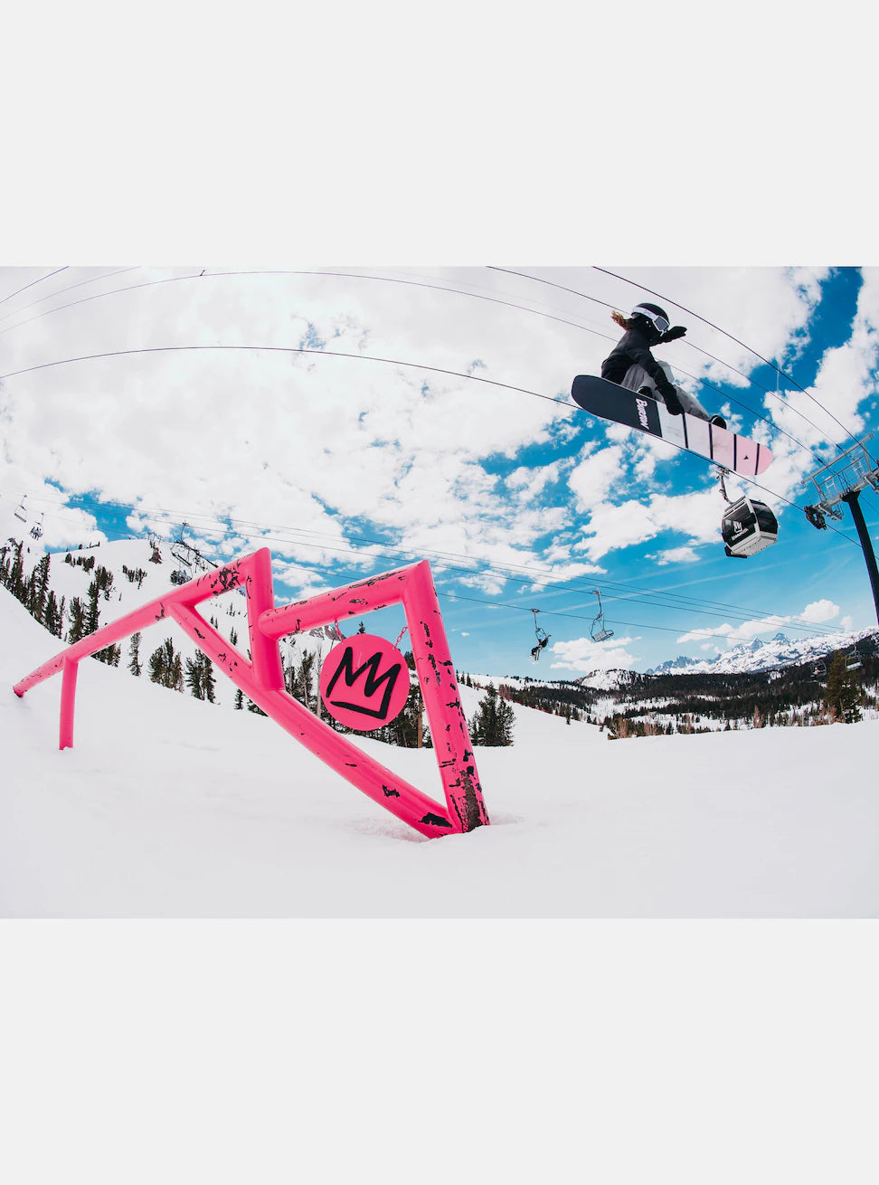 Burton Junior's Smalls Snowboard 2025 - A black snowboard with white lettering and a pink logo on its underside.