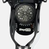 Burton Junior's Grom Step On Snowboard Bindings - Black bindings with silver buckles and straps on a white background.