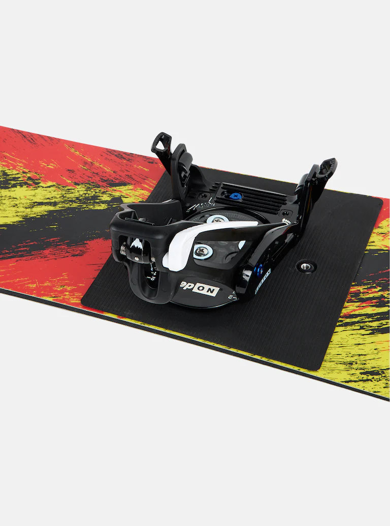 Burton Junior's Grom Step On Snowboard Bindings - A black and white binding with a circular logo on the front, featuring a small mountain peak design.