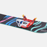 Burton Junior's Grom Step On Snowboard Bindings - A black snowboard with blue and pink stripes, featuring a red, white, and blue binding in the center.