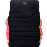 Hyperlite Women's Cadence Comp Vest 2024 - A black vest with a subtle floral pattern and orange accents on the straps.