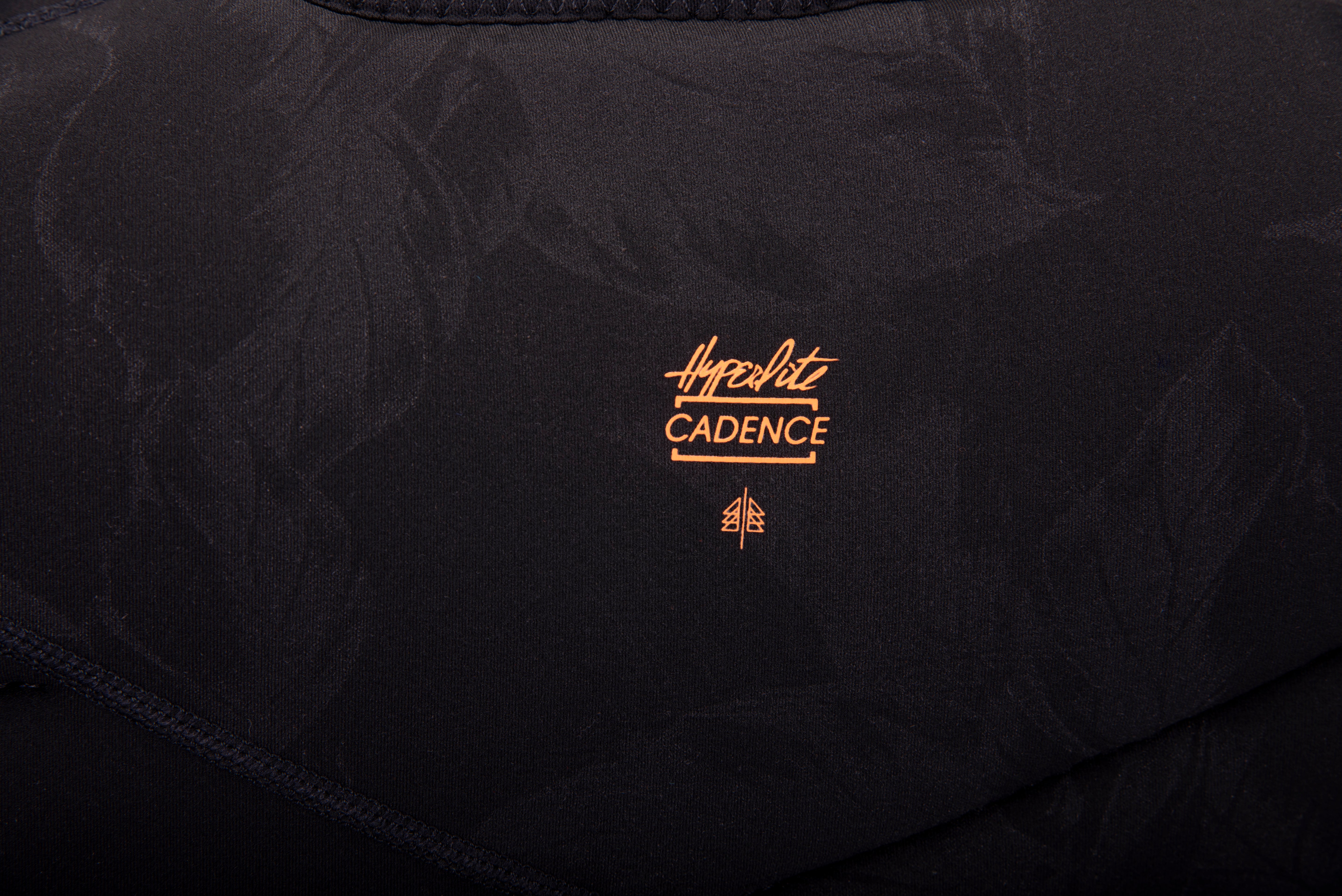 Hyperlite Women's Cadence Comp Vest 2024 - A black women's vest with a white logo on the chest and a zipper down the front.