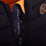 Hyperlite Women's Cadence Comp Vest 2024 - Black vest with orange accents and zipper down front.