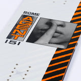 Rome Agent Snowboard 2025 - A white snowboard with black and orange stripes on its side, featuring a black-and-white photo of a man's face in a square frame.