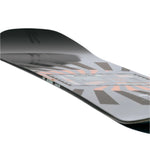 Rome Mechanic Snowboard 2025 - A snowboard with a black top sheet and light blue accents, featuring a geometric pattern of dark gray shapes.