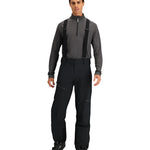 Obermeyer Force Insulated Suspender Pant 2025 - Black insulated snow pants with adjustable suspenders and zippered leg pockets.