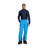 Obermeyer Force Insulated Suspender Pant 2025 - A pair of bright blue snow pants with black suspenders and a zippered pocket on the thigh.