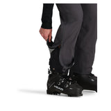 Obermeyer Foraker Shell Pant 2025 - Black snow pants with a zippered pocket on the thigh and adjustable cuffs at the ankles.