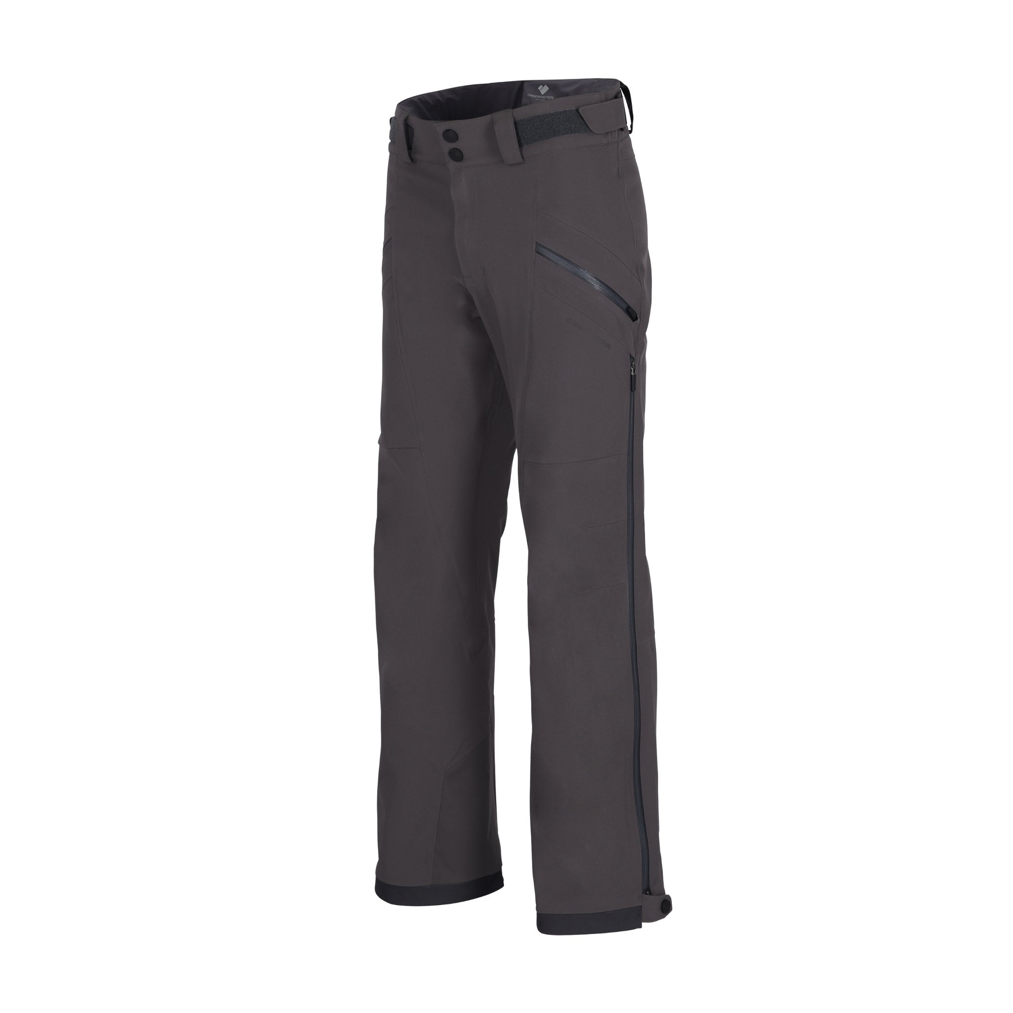 Obermeyer Foraker Shell Pant 2025 - A pair of dark gray snow pants with a black zipper on the right thigh and two black buttons on the left waistband.